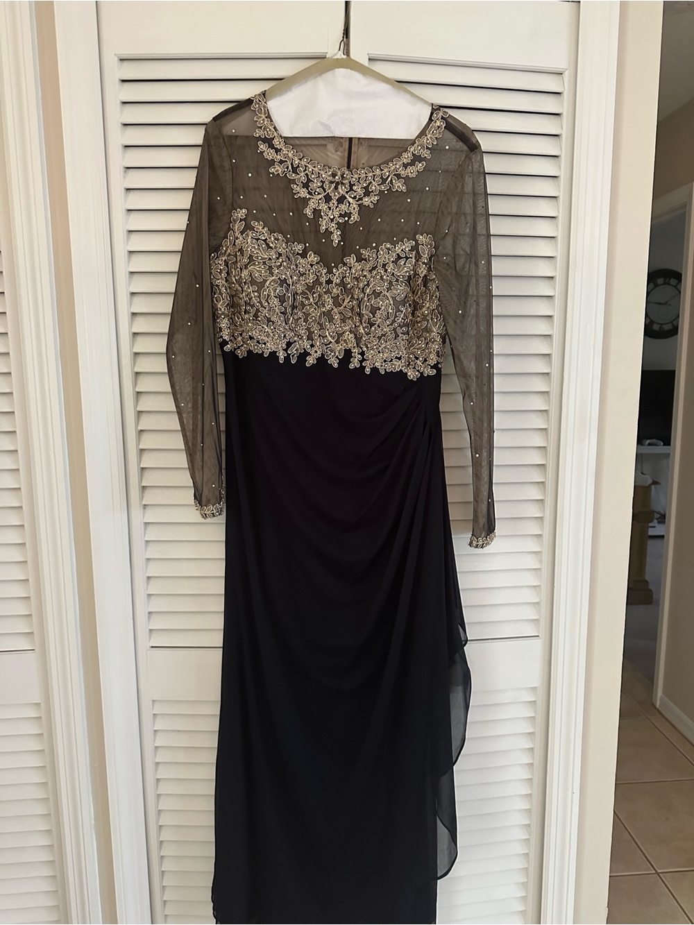 Xscape Black Long-Sleeve Evening Gown with Gold Embellishment